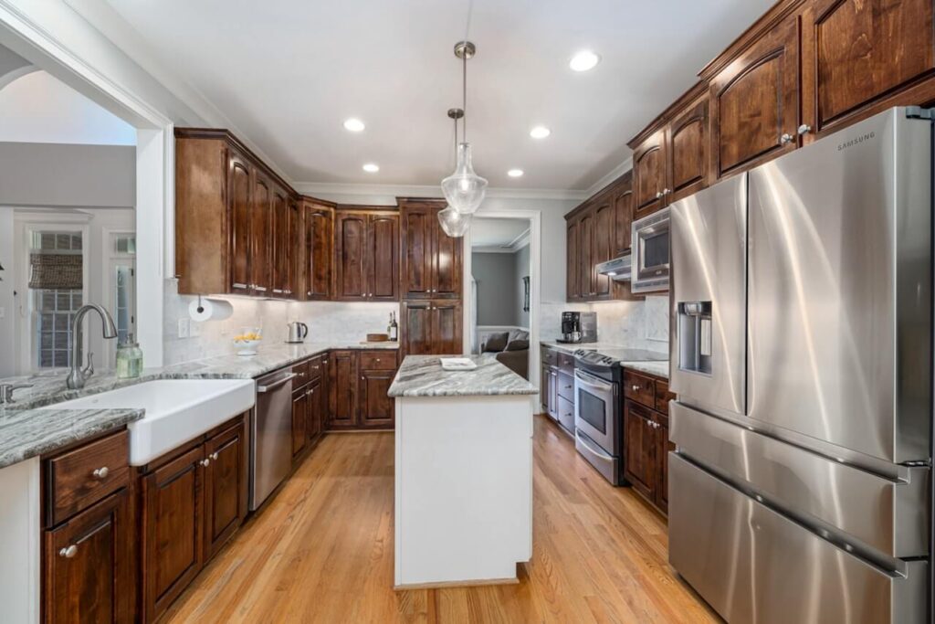 A large kitchen with a fridge